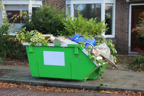 Rubbish removal crew loading items during clearance